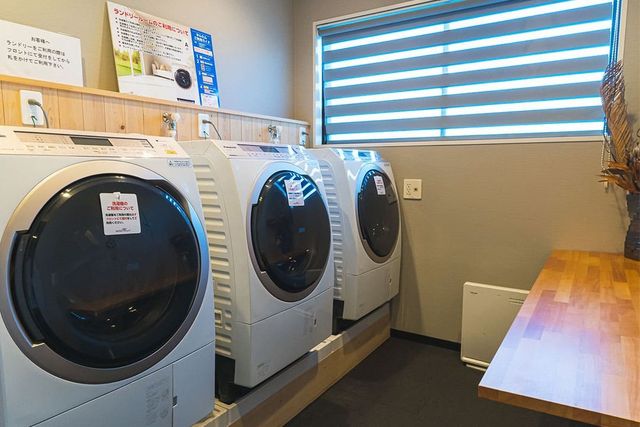 Free laundry room with three washer-dryers