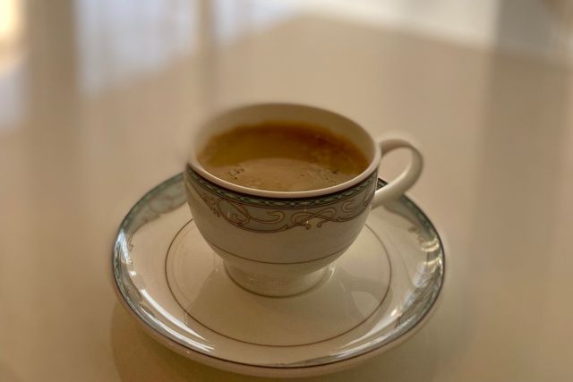 Coffee in a cup and saucer (illustrative photo)